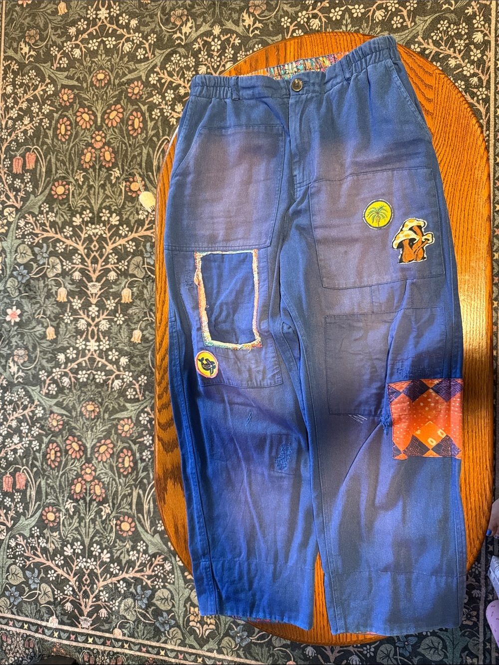 Kimchi Blue navy blue pants with multicolor patterned waist